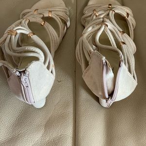 Shoes upper is a shinny rope sandal, a Gold heel as shown with zipper back.